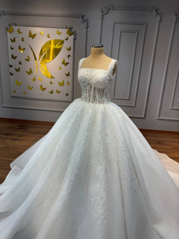 Square neckline ball gown wedding dress with a lace bodice and full skirt